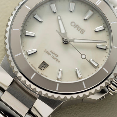 36.5MM Aquis Date
