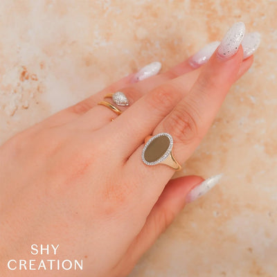 0.11 ctw Diamond Halo Oval Ring